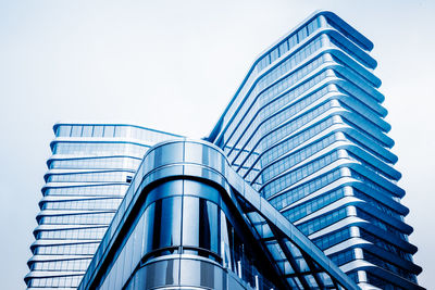 Low angle view of modern building against clear sky