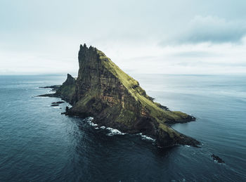 Aerial view of the rugged tindhólmur island on the faroe islands.