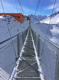 Stubnerkogel suspension bridge over snow covered field