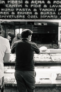 A customer buying bread from the bakery