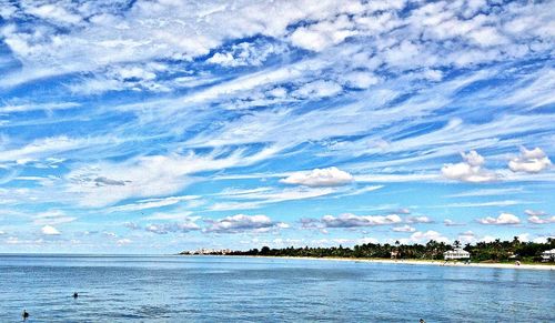 Scenic view of sea against cloudy sky