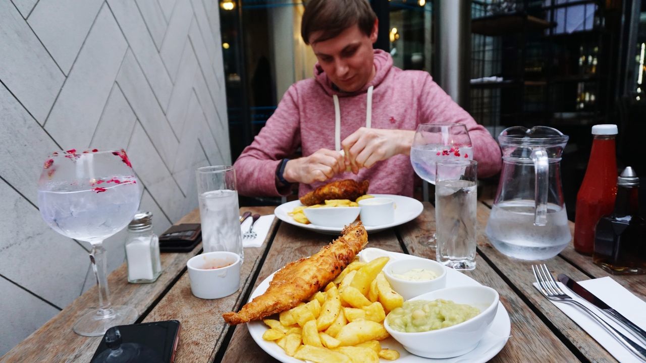 food and drink, table, food, drink, prepared potato, glass, potato, refreshment, one person, plate, drinking glass, french fries, eating utensil, ready-to-eat, business, household equipment, restaurant, freshness, indoors, unhealthy eating, meal, fried