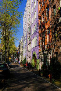 Street amidst buildings in city against sky