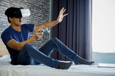 Man using virtual reality at home