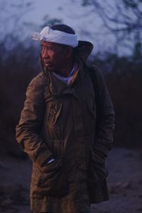Man wearing hat standing on land