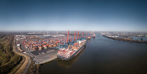 Large panorama of the port of hamburg with container terminal in sunny weather