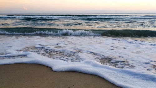 Scenic view of sea against sky during sunset