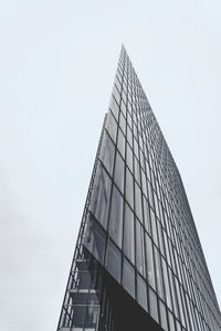 Low angle view of skyscraper against clear sky