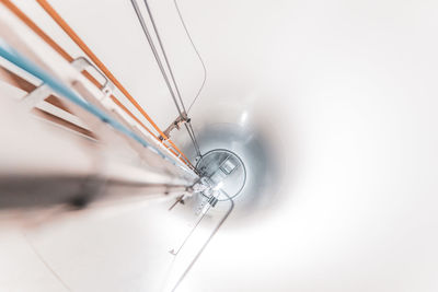 Low angle view of metal against white background