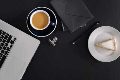 High angle view of coffee cup on table