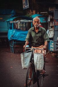 Front view of man riding bicycle