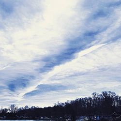 Scenic view of mountains against cloudy sky