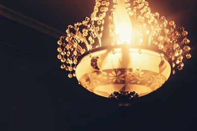 Low angle view of illuminated light bulb