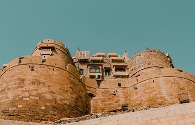 Low angle view of old building against clear sky