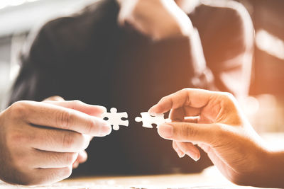 Close-up of people holding hands