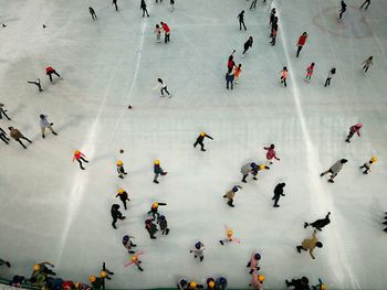 High angle view of people doing ice skate on snow