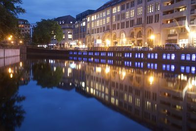 Reflection of illuminated buildings in lake at night