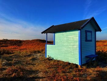 House on field against sky