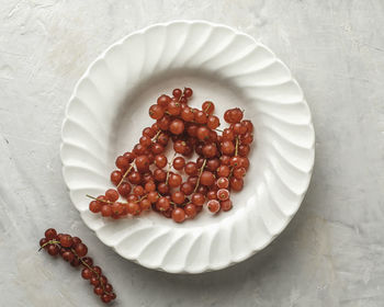 High angle view of strawberries in plate on table