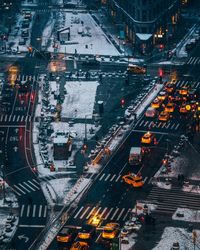 High angle view of traffic on city street during winter