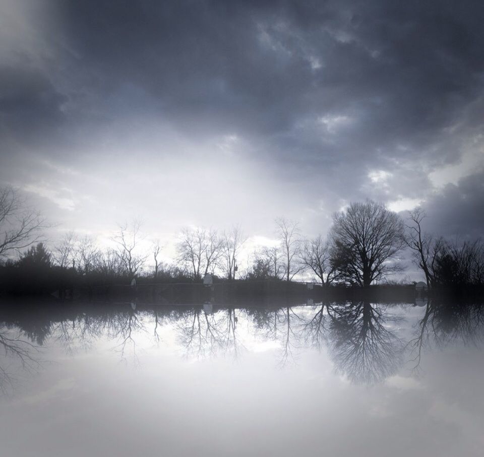 sky, water, tranquility, tranquil scene, cloud - sky, lake, tree, scenics, reflection, beauty in nature, silhouette, cloudy, nature, cloud, waterfront, bare tree, idyllic, sunset, calm, river