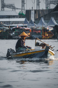 Man in boat at river