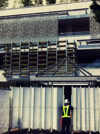 Woman standing in front of building