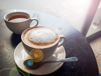 High angle view of coffee cup on table