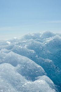 Aerial view of landscape against blue sky