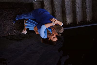 High angle view of friends on floor