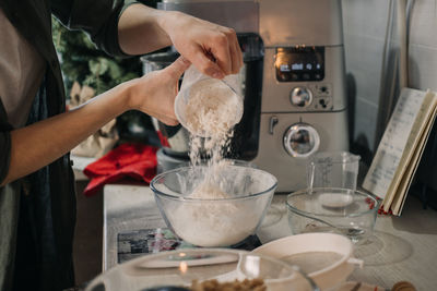 Cooking dough for gingerbread. products and ingredients on kitchen table ready for making christmas