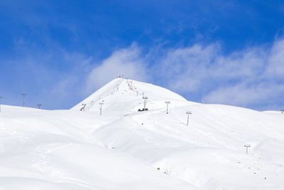 Georgian ski resort in gudauri. snowy mountains, daytime and sunlight.