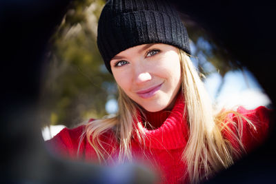 Portrait of smiling young woman in winter