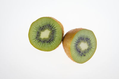 Close-up of oranges over white background