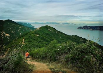 Scenic view of mountains against cloudy sky