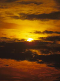 Low angle view of dramatic sky during sunset