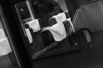 Close-up of hand on car window