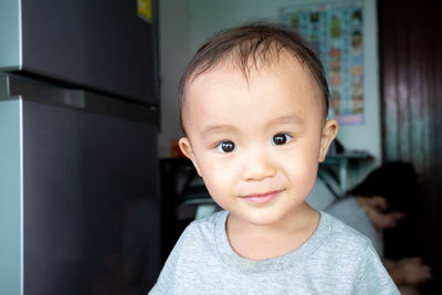 Portrait of cute baby at home