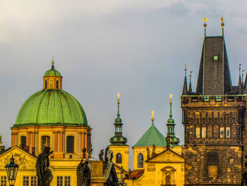 View of buildings in city against sky