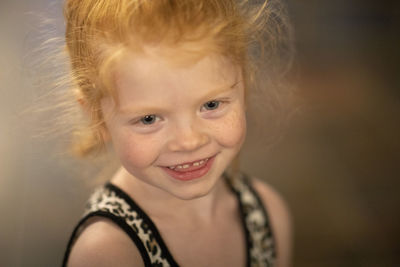 Close-up portrait of smiling cute girl