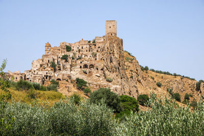 Low angle view of old ruins against clear sky