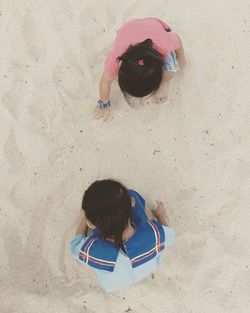 Directly above shot of children playing on beach