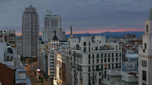Buildings in city at dusk
