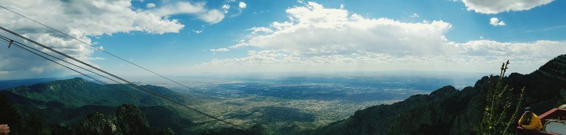 Scenic view of mountains against cloudy sky
