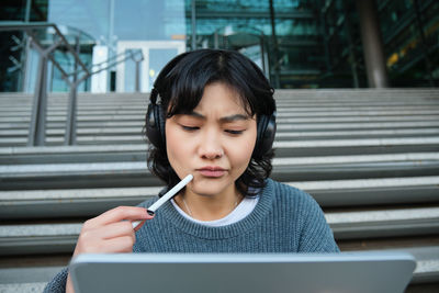 Young woman using mobile phone