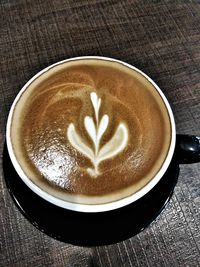 High angle view of cappuccino on table