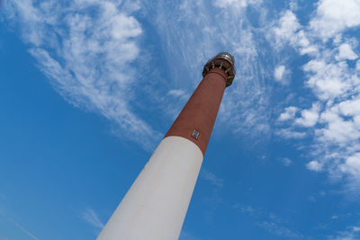 Low angle view of communications tower against sky