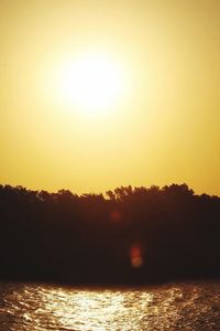 Scenic view of silhouette trees against sky during sunset