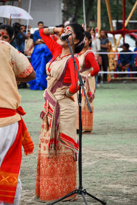 Rear view of people enjoying music concert