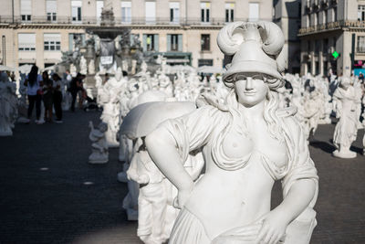 Close-up of statues in city
